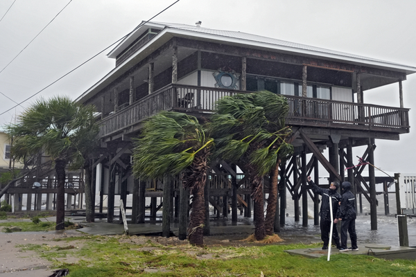 Storm chasers check wind speed Monday near a Florida home during Hurricane Debby.
 on the Gulf of Mexico Monday, Aug. 5, 2024, in Horseshoe Beach, Fla. Hurricane Debby made landfall early this morning. (AP Photo/Christopher O'Meara)