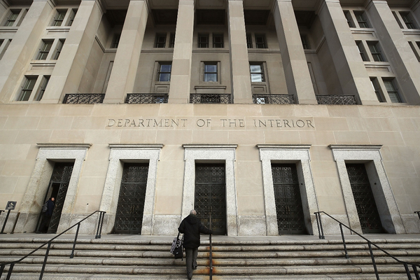 A worker arrives at the Department of Interior.