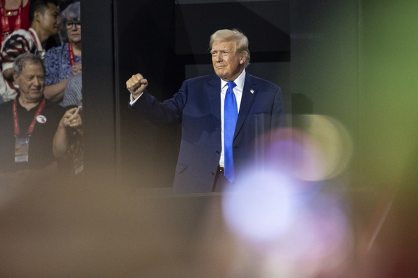 Former President Donald Trump gestures to supporters as he arrives for the second night of the Republican National Convention.