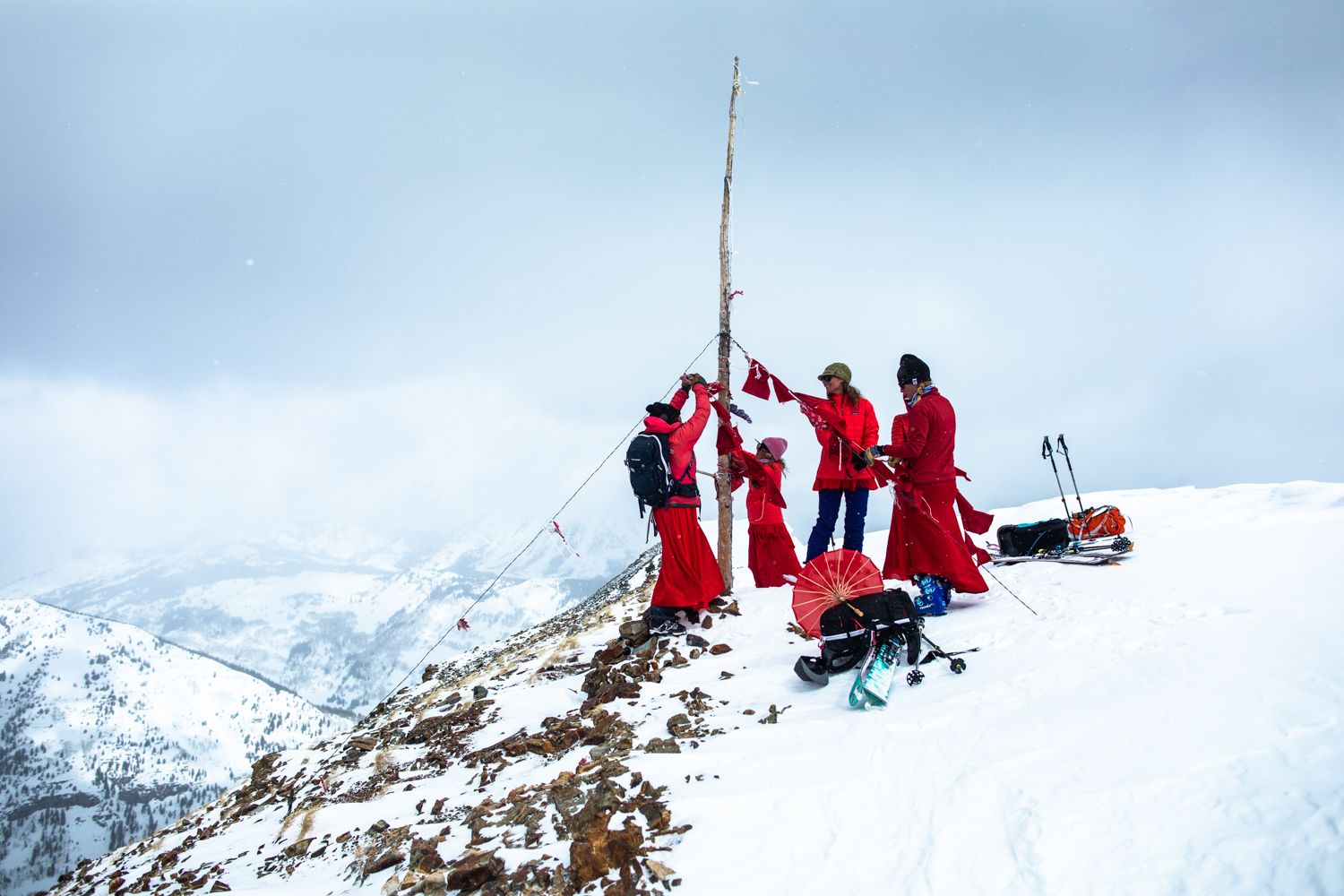 Local residents opposed to the mining of Mount Emmons near Crested Butte — also known as the "Red Lady" — hang flags during a ski protest.