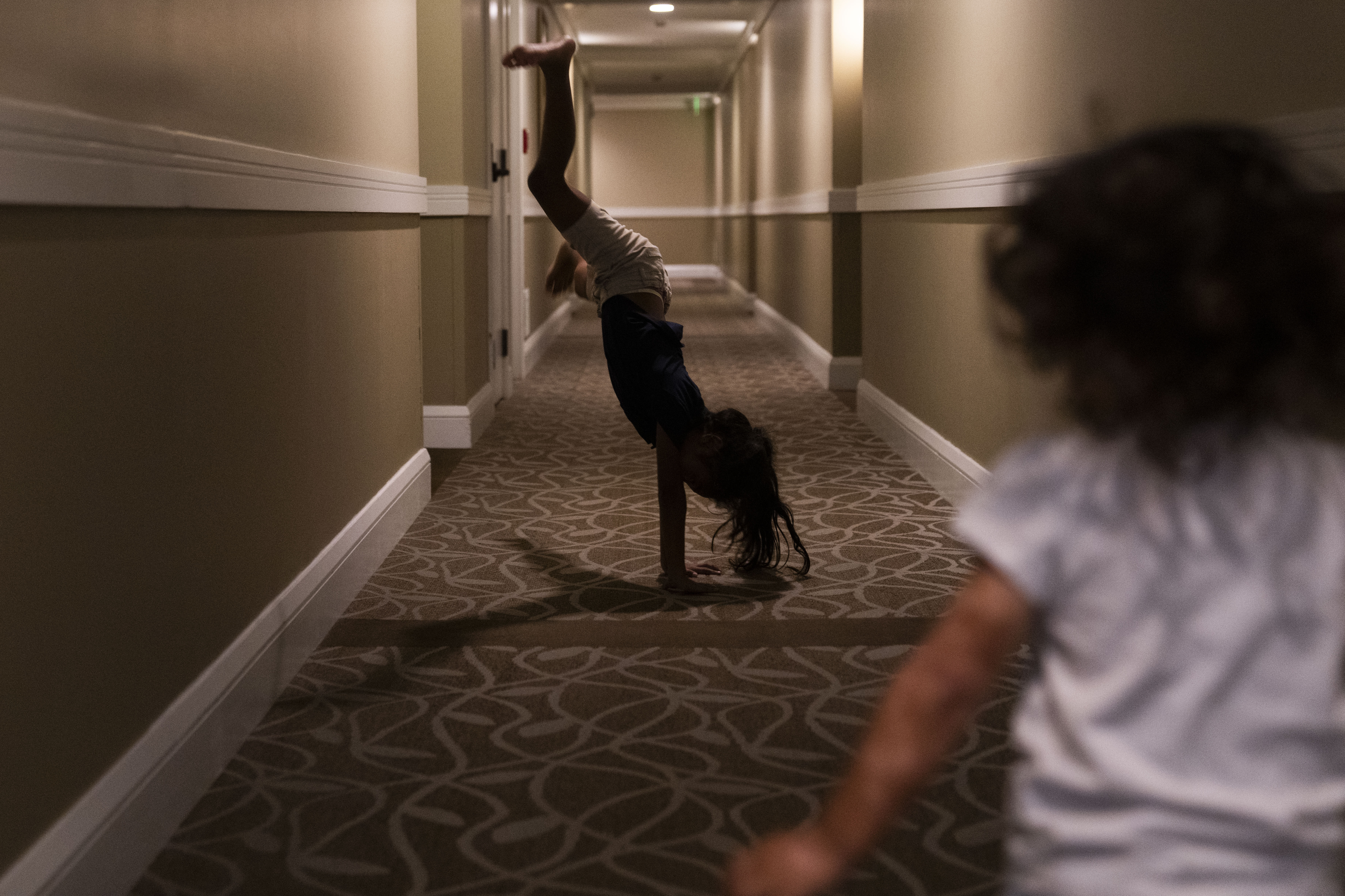 Children who were displaced by the fire play in the halls of Honua Kai Resort & Spa, a hotel occupied by some survivors. 