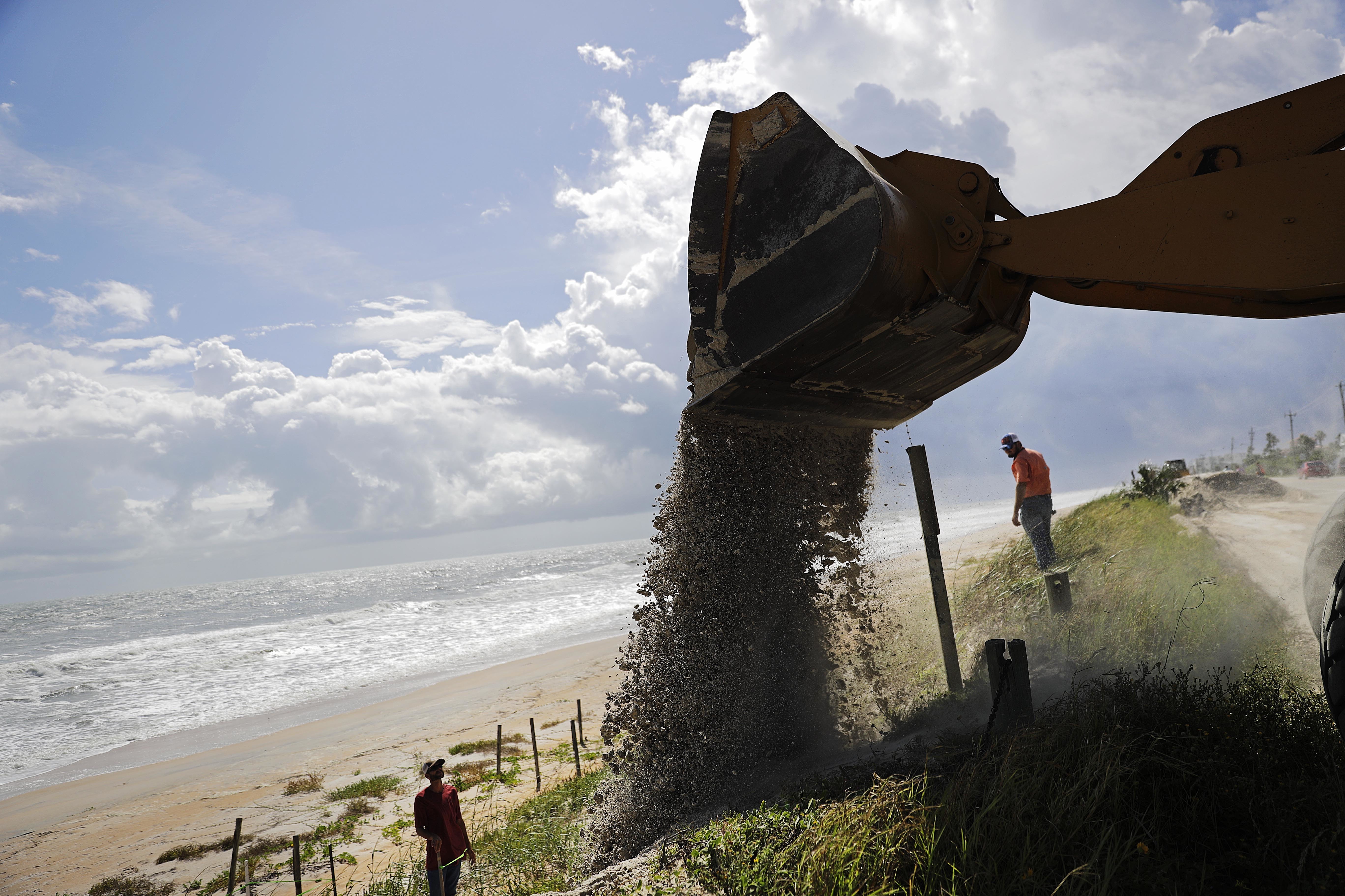 Sand is dumped on Flagler Beach, Florida, ahead of Hurricane Irma in 2017. 